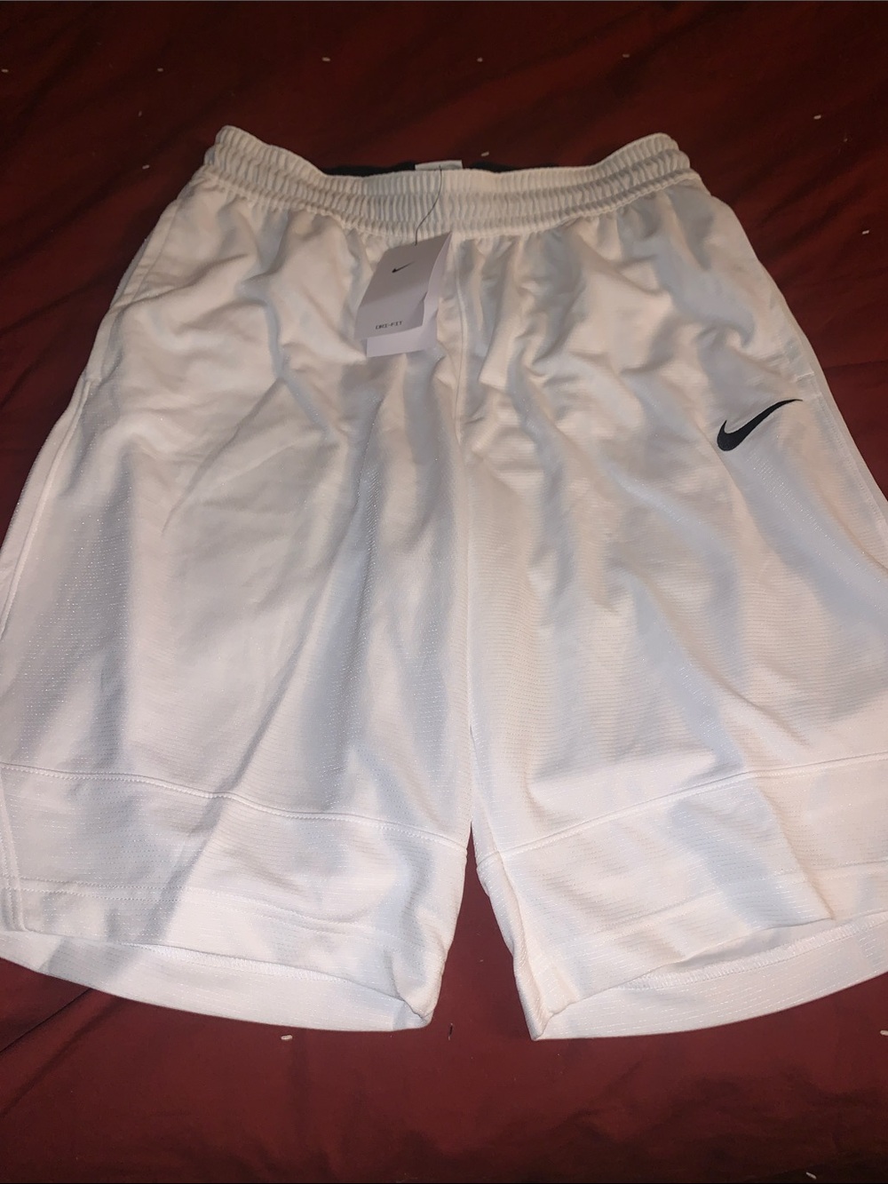 Nike Men’s White Athletic Shorts with Black Swoosh Medium